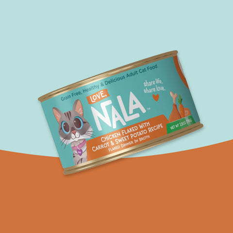 A single can of NALA Love adult cat food, featuring a teal and orange label with a cartoon cat illustration, shown at an angle against a split light blue and orange background.